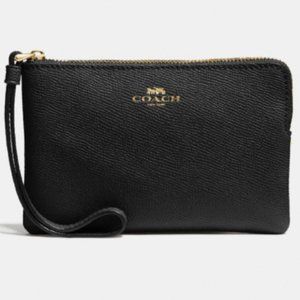 Black and gold Coach wristlet clutch